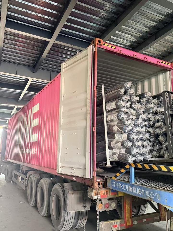 Agricultural product rolls being loaded into an export container